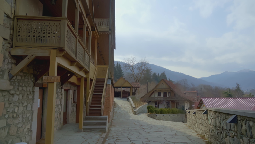 Ancient wooden city. ACTION. Wooden terrace made of wood on the street. Saloon in a warm country