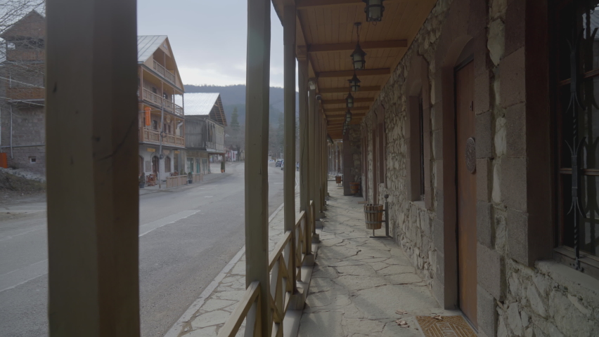 Ancient wooden city. ACTION. Wooden terrace made of wood on the street. Saloon in a warm country