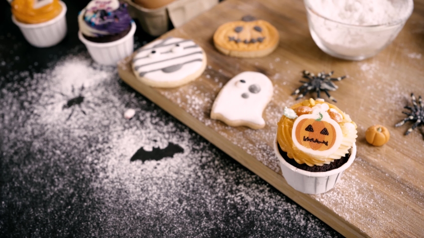 Cooking delicious homemade cake and decorate cupcake for Halloween festive. | Shutterstock HD Video #1091895677