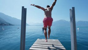 Man diving into lake person running on pier and dives into water - Powered by Shutterstock - Get 15% off with code: PIKWIZARD15