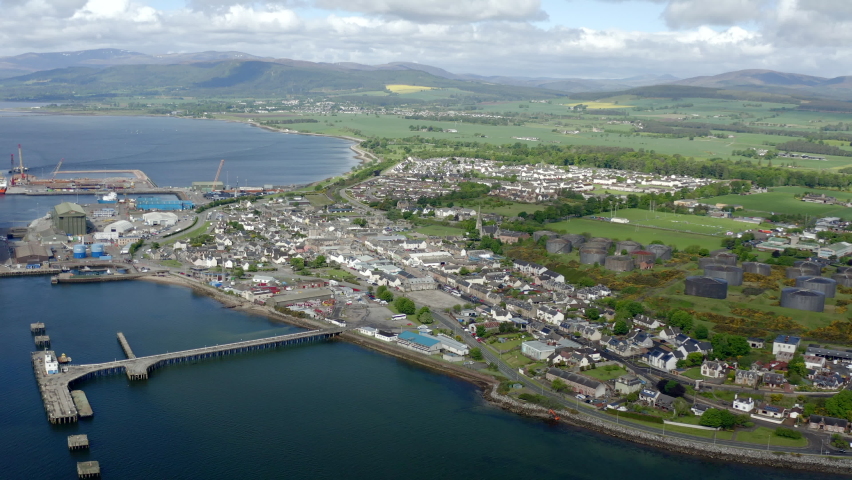 Flight above Invergordon - Scotland. City establishing shoot.