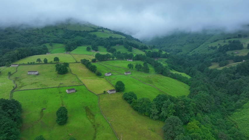 Spring landscape of meadows, pasiega cabins and Atlantic forest in the surroundings of the municipality of San Pedro del Romeral. Pas Miera region. Pasiegos Valleys, Cantabria, Spain, Europe