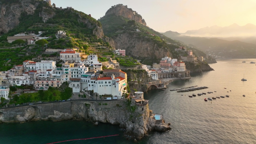 famous Amalfi coast in Italy, aerial view of sunrise in Amalfi, seacoast of Italy near Naples, vacations on the Mediterranean coast in Italy. High quality 4k footage Royalty-Free Stock Footage #1091909129