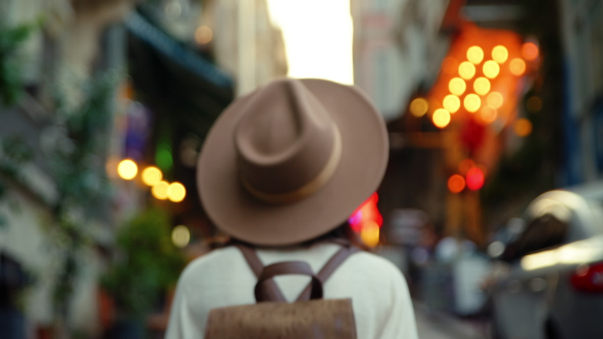 Young traveler with brown backpack on vacation 