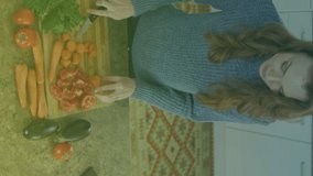 Animation of organic produce text over caucasian woman cutting vegetables. national vegetarian week and celebration concept digitally generated video.