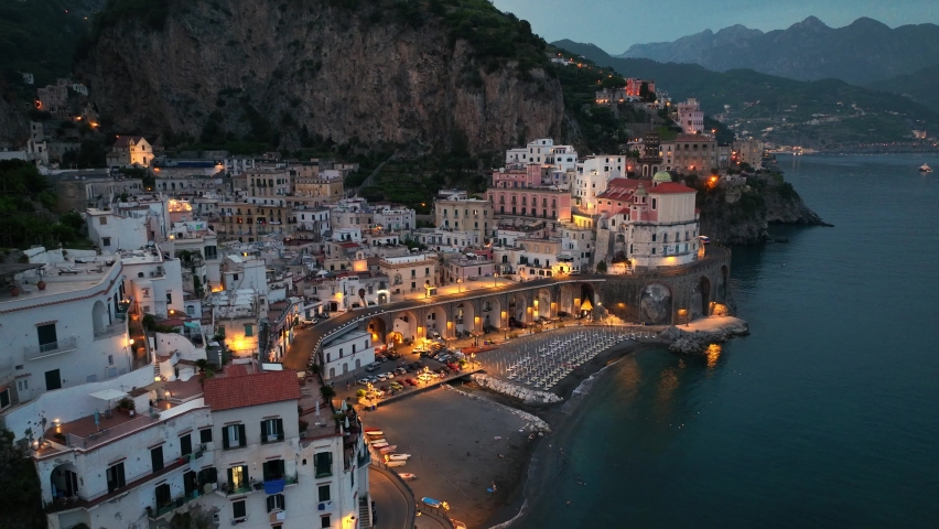 Aerial view of Amalfi town at night in Italy, famous Amalfi coast in the evening, touristic mediterranean town on the coast near Naples. High quality 4k footage | Shutterstock HD Video #1091913041