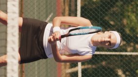 Video of focused caucasian female tennis player holding racket and hitting ball. professional tennis training, sport and competition concept.