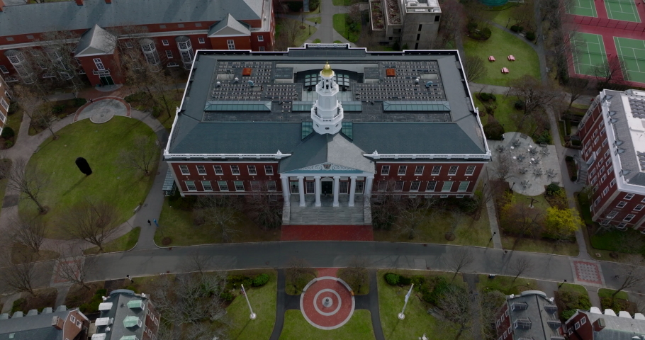 Aerial descending shot of Baker Library building. Beautiful brick building with white tower. Boston, USA Royalty-Free Stock Footage #1091917735