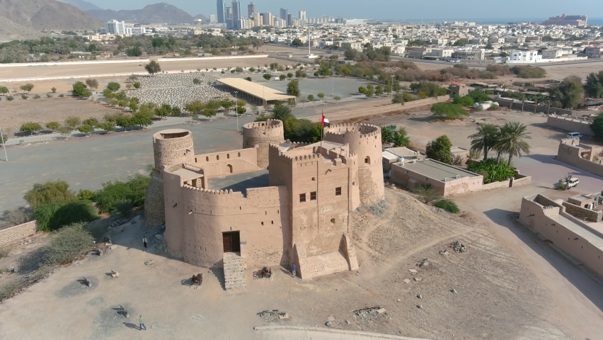 Drone view over Fujairah Fort, 2022

Fujairah Fort is a fort in the city of Fujairah, United Arab Emirates, 2022
 | Shutterstock HD Video #1091918799