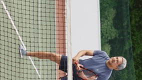 Video of happy biracial senior couple during training on tennis court. active retirement lifestyle, senior relationship and tennis training concept. - Powered by Shutterstock - Get 15% off with code: PIKWIZARD15