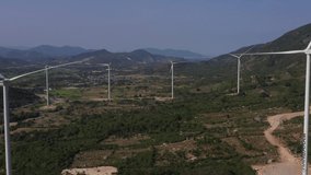 Landscape with Turbine Green Energy Electricity, Windmill for electric power production, Wind turbines generating electricity on rice field at Thuan Bac, Ninh Thuan, Vietnam. Clean energy concept.