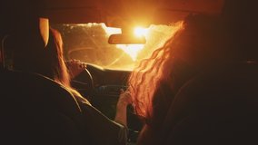 Two happy female woman friends enjoy travel in car. Sitting in front seat and have fun music song on road trip. Girls driving car and dancing. Concept of youth, friendship, holidays, sunset vacation. - Powered by Shutterstock - Get 15% off with code: PIKWIZARD15