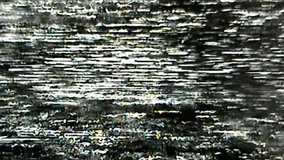 VHS glitch error. Grain noise texture. Analog TV distortion overlay. White black fuzzy flicker artifacts on dark retro abstract background.