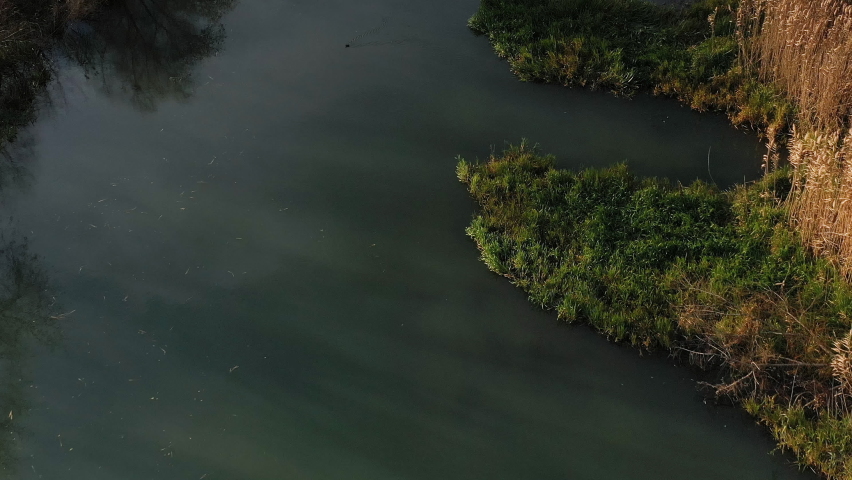 European old hydroelectric power plant in Timisoara - water sluice gate. Aerials footage. Timisoara city, Timis County – Romania; CCA. 2020 - during the COVID-19 pandemic.