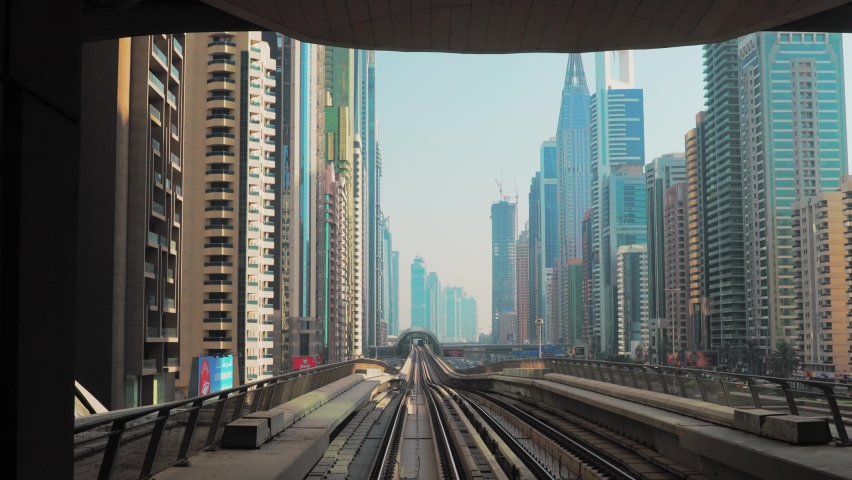monorail Metro In Dubai, United Arab Emirates. FPV POV At Fast Speed Drive Motion. driverless metro. futuristic city skyline in UAE.street motion Dubai Subway Tunnel.