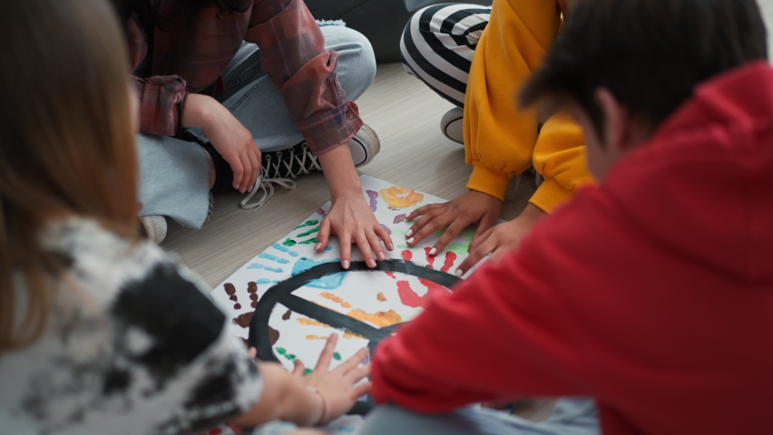 Cut out of students praying for peace in world at school.