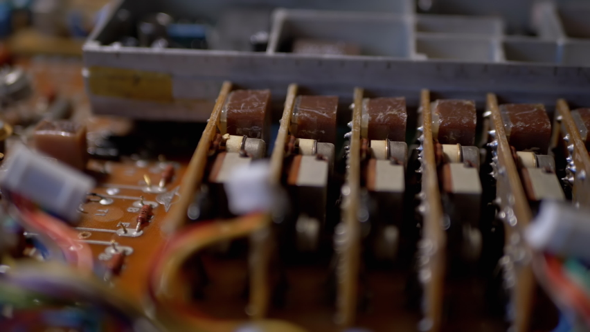 Lots Old Boards with Radio Components, Transistors, Chips, Resistors, Capacitor. Electronic circuit boards of retro TVs with preciou metal, gold, platinum, silver, tantalum. Scheme. 4K. Close-up