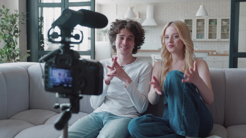 teenage couplel talking in camera for they video channel on social media