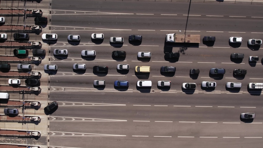 Aerial top down Timelapse of cars waiting in traffic to go through tolls on highway | Shutterstock HD Video #1091964969