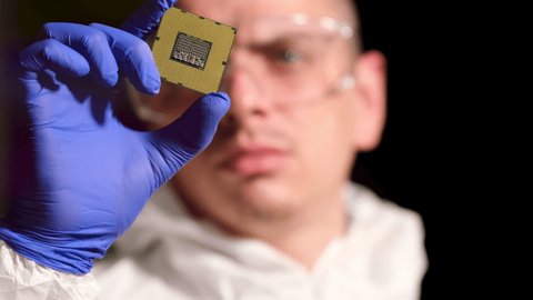Young Computer Engineer Holds Tests Processor Stock Footage Video (100% ...