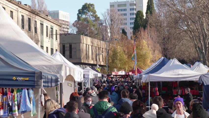 Hobart , Tasmania , Australia - 07 02 2022: Hobart, Tasmania, July 2nd 2022 - Tourist and locals wandering stalls on streets of iconic Salamanca Market in Hobart, Tasmania