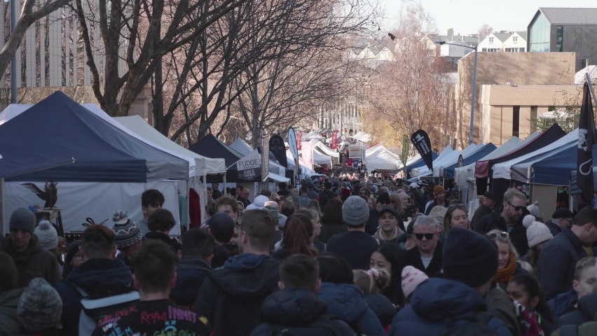 Hobart , Tasmania , Australia - 07 02 2022: Hobart, Tasmania, July 2nd 2022 - Top view of tourist and locals wandering stalls on streets of iconic Salamanca Market in Hobart, Tasmania