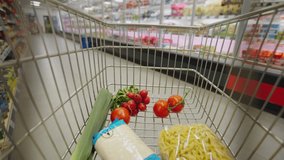 Woman with shopping cart or trolley buying food at grocery store or supermarket, inside view from trolley - Powered by Shutterstock - Get 15% off with code: PIKWIZARD15