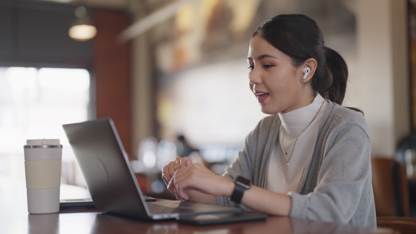 Future of workforce work hybrid anywhere workplace for Gen Z talent. Young adult asia people sit relax video call talk online telework or study MBA class at coffee shop cafes. Happy digital nomad job. | Shutterstock HD Video #1091997621