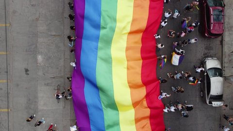 tracking view of pride parade walking with people from the LGBT community – Video có sẵn