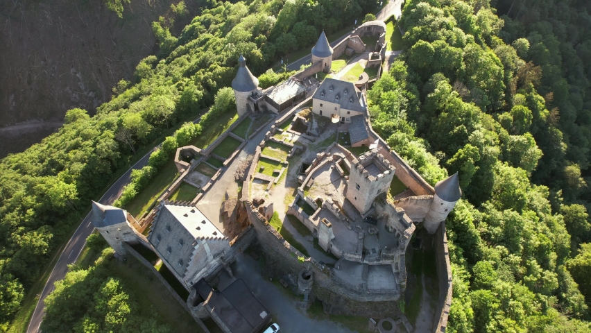 Bourscheid Castle is located near the village of Bourscheid in the north of Luxembourg. It is a medieval castle dating back to Roman times, and it has a circular wall with multiple watch towers.