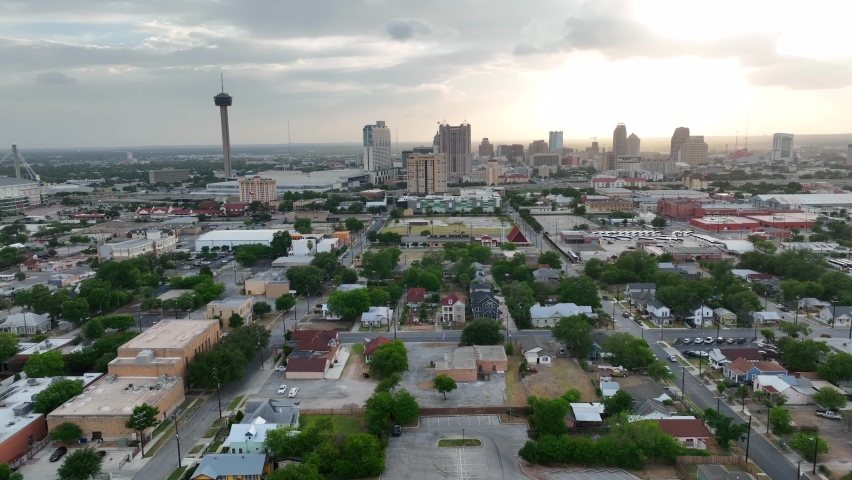 San Antonio Texas at sunset. Neighborhood community on outskirts of downtown. Dramatic skyline view in evening light. Aerial truck shot. Royalty-Free Stock Footage #1092011463