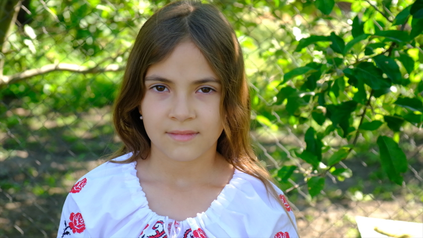 The Ukrainian flag is drawn on the child hands. Selective focus.