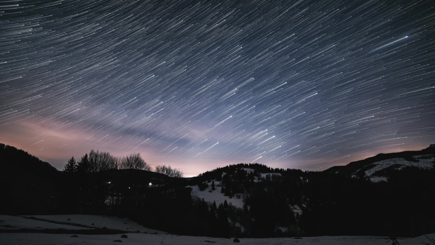 Magic beauty of startrails milky way galaxy motion above winter country in starry night sky, Astronomy Stars Time lapse