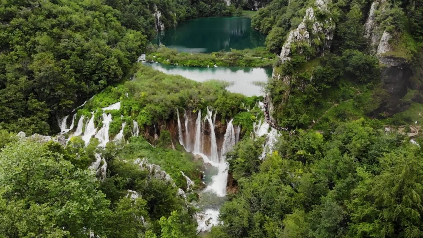 Plitvice lakes National Park Croatia, Europe, aerial view of waterfall and vibrant colored lakes Royalty-Free Stock Footage #1092020625