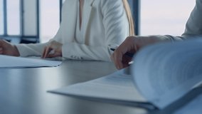 Business team checking documents in office closeup. Man hand analyze report. Unrecognizable financial partners lawyers study legal papers. Couple read signing divorcing contract agreement. - Powered by Shutterstock - Get 15% off with code: PIKWIZARD15