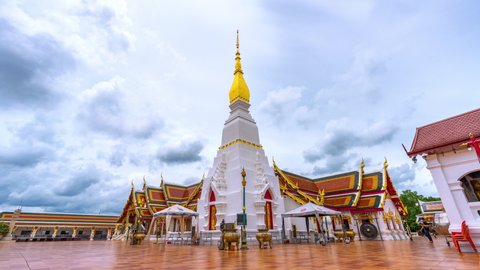 SAKON NAKHON,THAILAND- JULY 2,2022:Time lapse of Buddhists come to pay their respects at Wat Phra That Choeng Chum a major and sacred religious monument of Sakon Nakhon Province in Thailand.