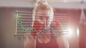 Animation of graph over caucasian woman boxing. Global sport, computing and digital interface concept digitally generated video. - Powered by Shutterstock - Get 15% off with code: PIKWIZARD15