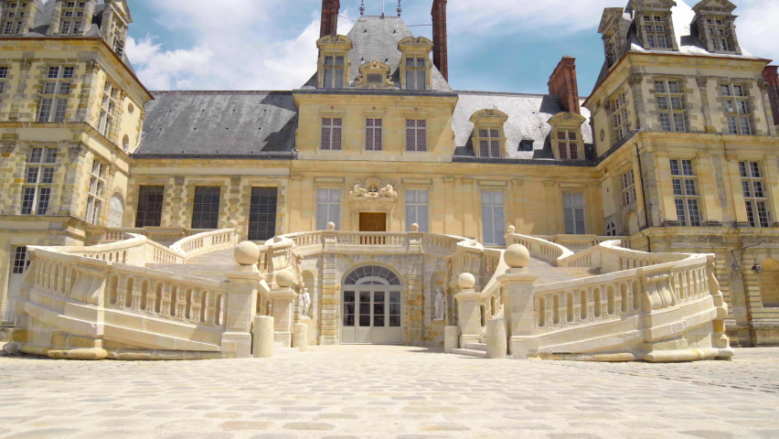 The Castle of Fontainebleau. Royal chateau de Fontainebleau in France, the residence of the French monarchs. The Castle of Fontainebleau and the stairway of the King. medieval landmark castle.  Royalty-Free Stock Footage #1092049947