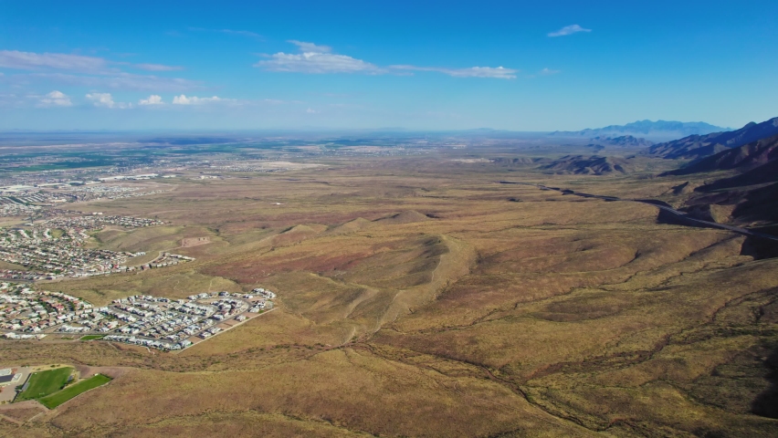 Northwest El Paso, Texas USA. Aerial Drone View Of Empty Desert Landscape With Residential And Commercial Real Estate Development Potential Near Famous US Mexico Bordertown Outskirts.