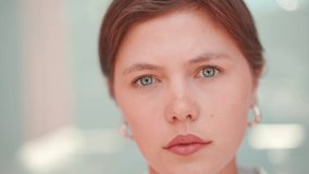 Businesswoman close up video portrait. Caucasian female business person standing outdoor looking at camera close up face. Young beautiful modern business woman 30s years. Confidence employer