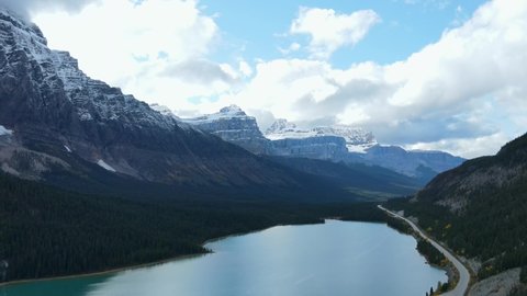Scenic View of water in a mountain forest lake with pine trees. Aerial drone view of blue lake and green forests in banff  national park.Lake between mountain forest.Crystal clear mountain lake water.