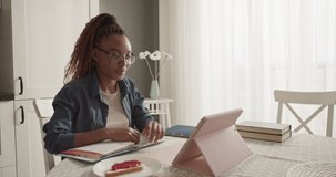 African American student having online lesson