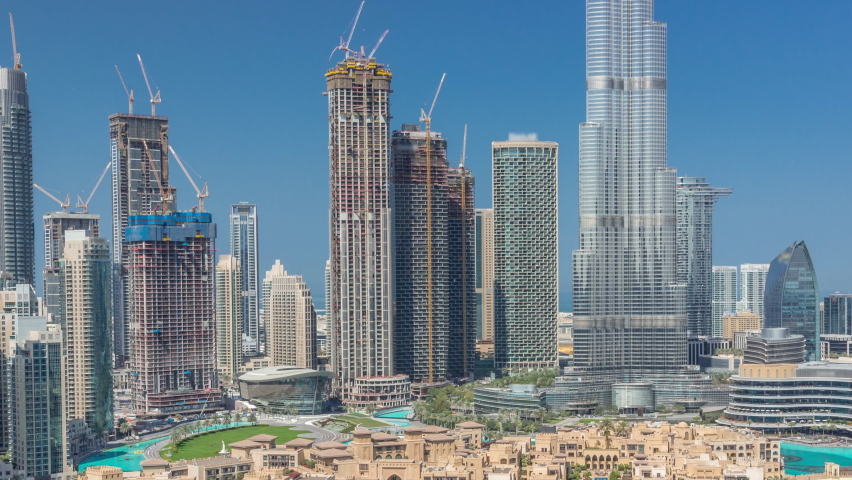 Dubai Downtown during all day timelapse with shadows moving fast from tallest skyscraper and other towers aerial view from the top, United Arab Emirates. Traditional houses of old town Royalty-Free Stock Footage #1092075639