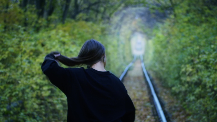 young happy girl tourist runs through the tunnel of love, running and health. happiness concept.