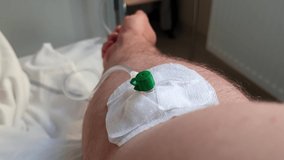 Man attached to a drip in a hospital, first person view - Powered by Shutterstock - Get 15% off with code: PIKWIZARD15