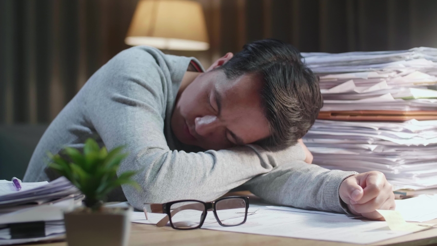 Close Up Of Tired Asian Man Sleeping Due To Working Hard With Documents At Home
 | Shutterstock HD Video #1092082355