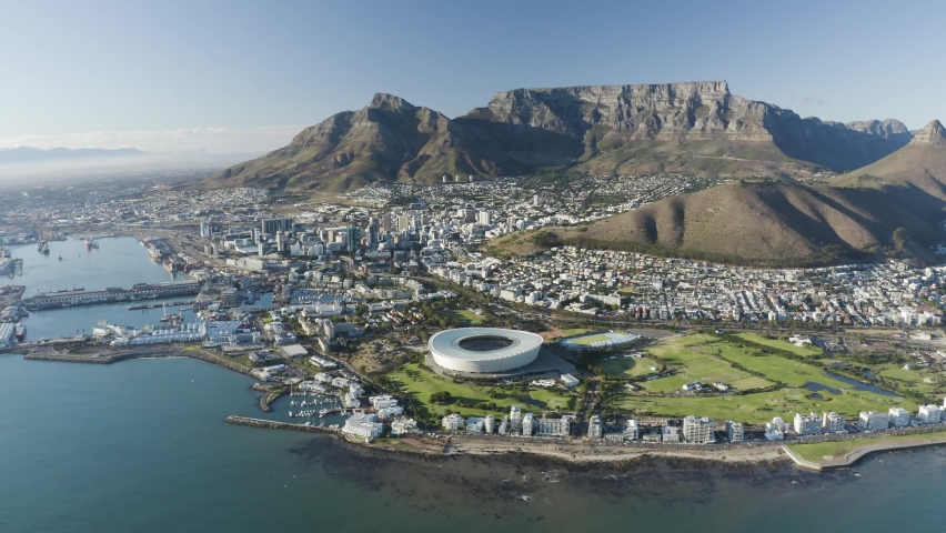 Aerial View of Cape Town Stadium and the city, Western Cape, Cape Town, South Africa. Royalty-Free Stock Footage #1092084427