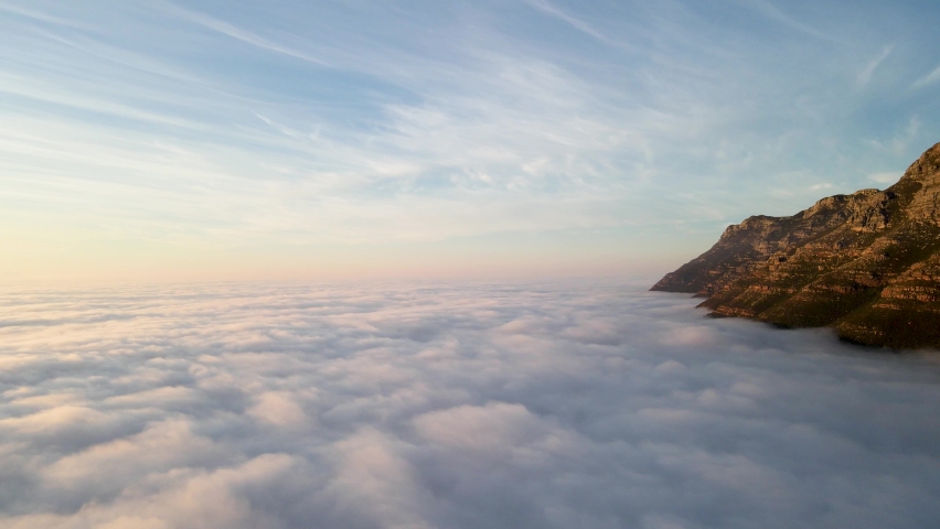Aerial view of False bay covered in low cloud sunrise, Simonstown, Cape Town, South Africa.