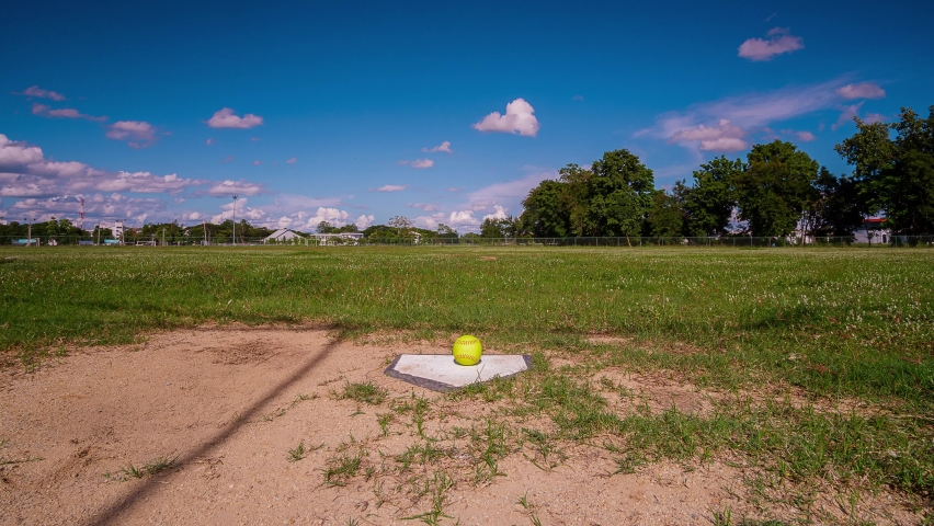 Time Lapse,Softball on the homepage in a softball field.