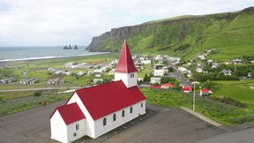 Church in Vik, Iceland with drone video circling.